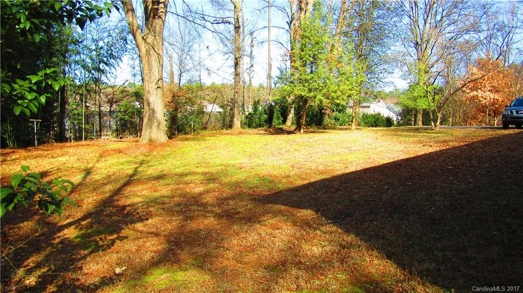 4901 Cheviot Road Charlotte, NC 28269 - Photo 21 of 23 a view of yard with swimming pool and trees