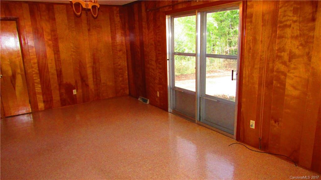 4901 Cheviot Road Charlotte, NC 28269 - Photo 9 of 23 a view of an empty room with a window