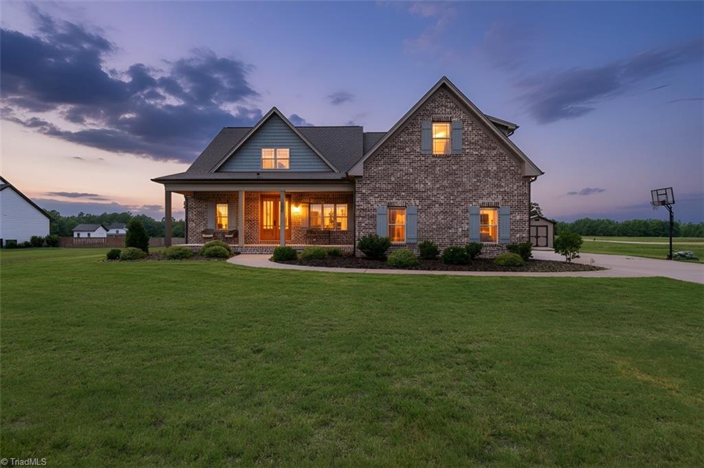 1144 Haynes Road Summerfield, NC 27358 - Photo 40 of 40 Twilight AI generated