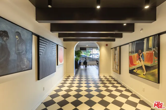 a bathroom with a sink mirror and window