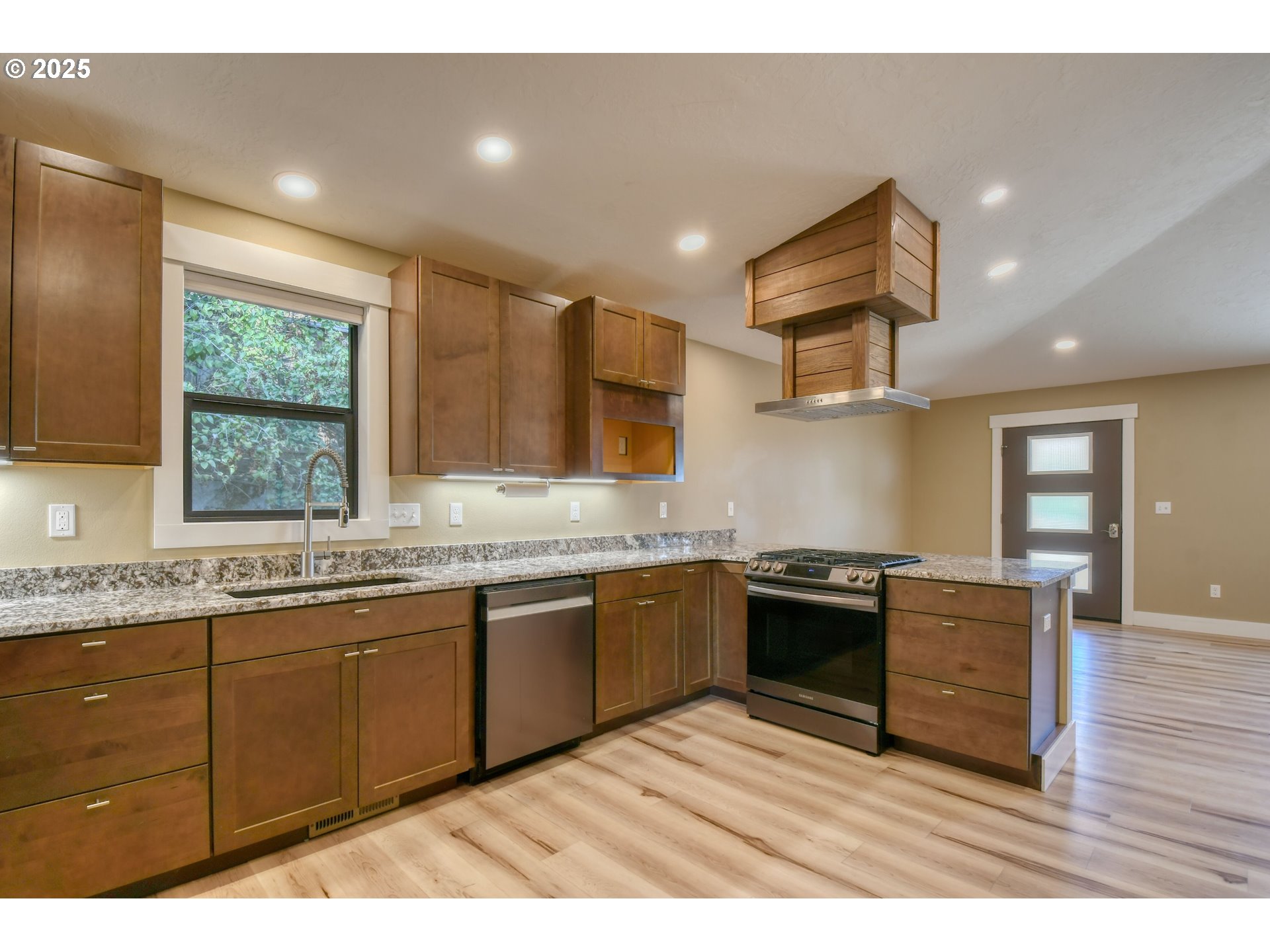 2716 Southwest Hailey Avenue Pendleton, OR 97801 - Photo 11 of 40 a kitchen with stainless steel appliances granite countertop a sink and stove top oven