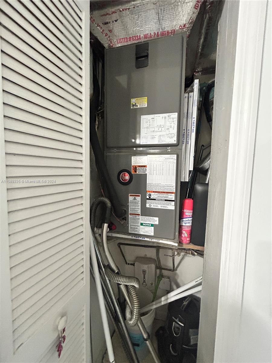 5050 Northwest 7th Street, Unit PH1 Miami, FL 33126 - Photo 14 of 36 a bathroom with a sink and a mirror