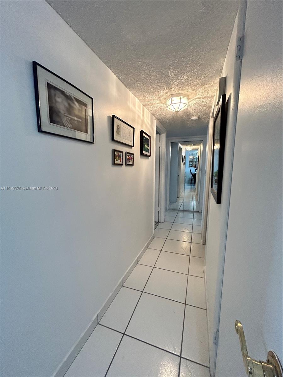 5050 Northwest 7th Street, Unit PH1 Miami, FL 33126 - Photo 17 of 36 a view of a hallway