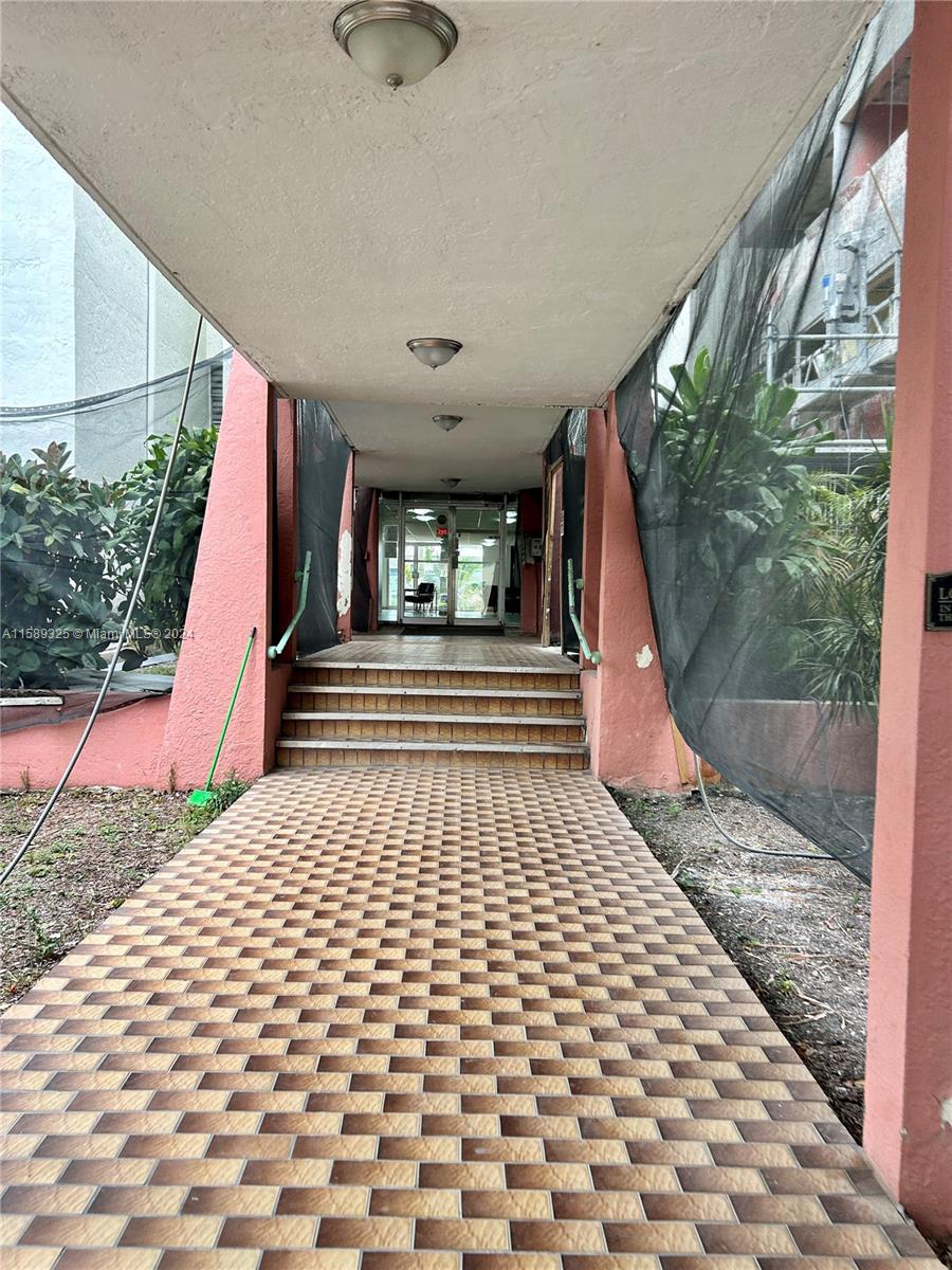 5050 Northwest 7th Street, Unit PH1 Miami, FL 33126 - Photo 2 of 36 a view of a entryway door