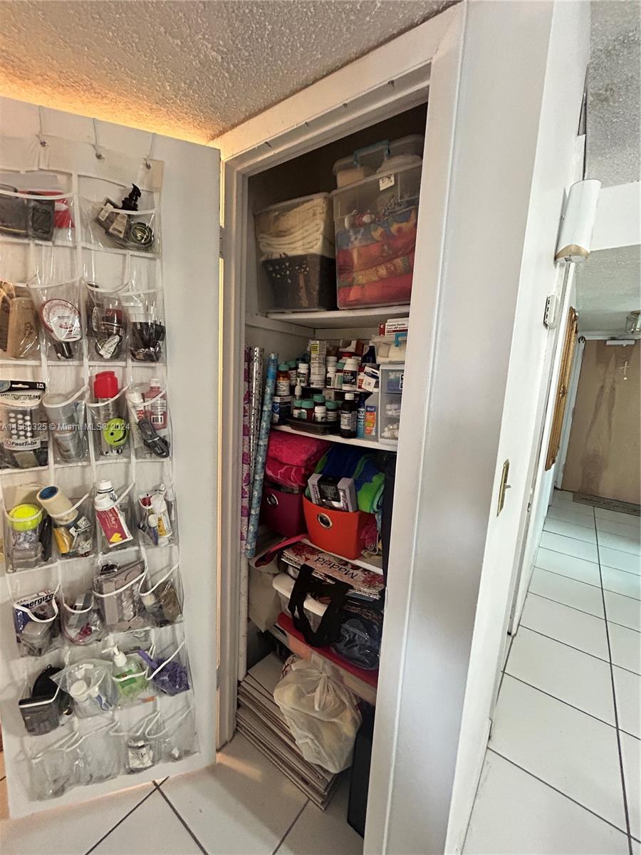 5050 Northwest 7th Street, Unit PH1 Miami, FL 33126 - Photo 32 of 36 a view of storage and utility room