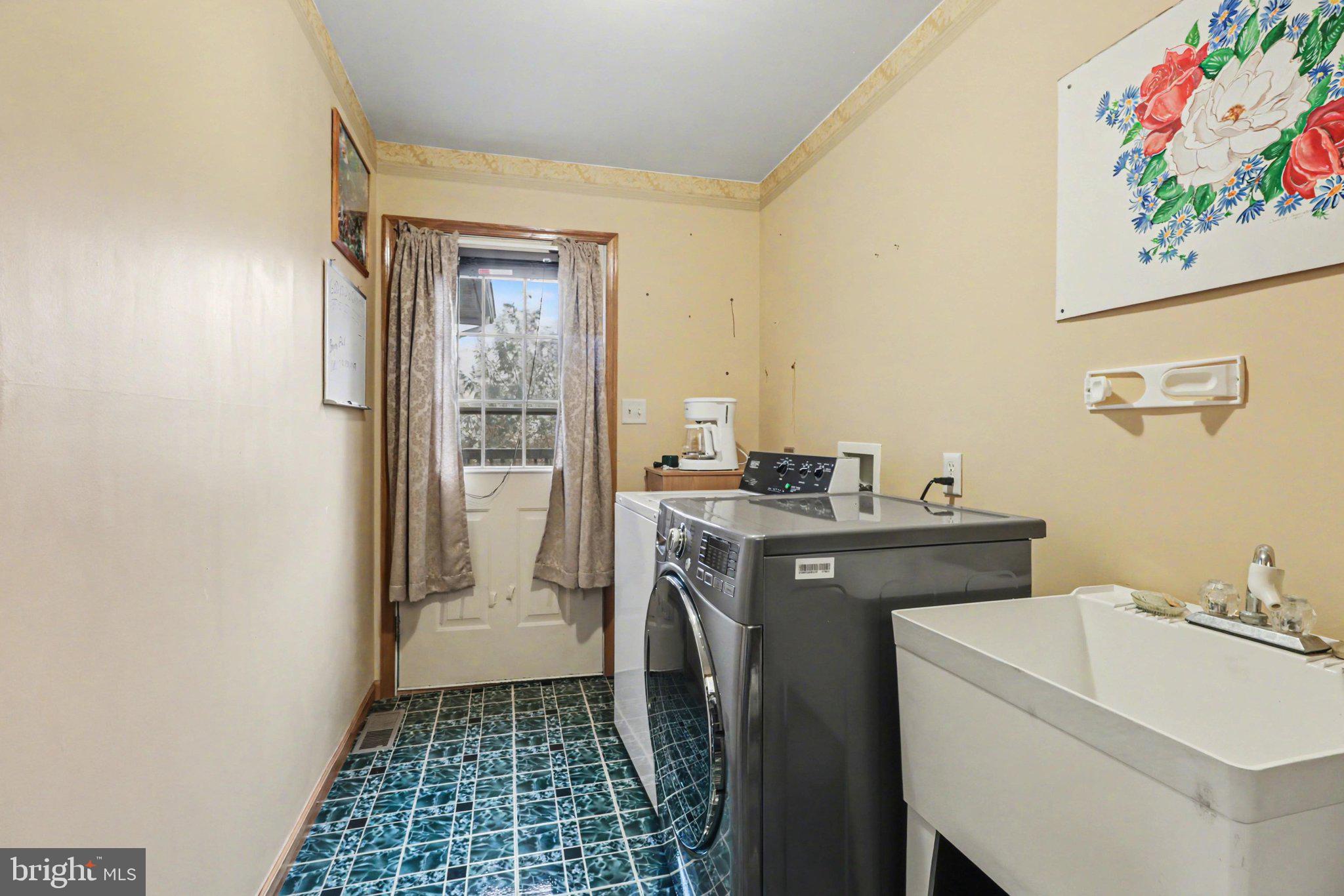 467 Beech Tree Street Shippensburg, PA 17257 - Photo 17 of 54 a utility room with a sink a washer and dryer