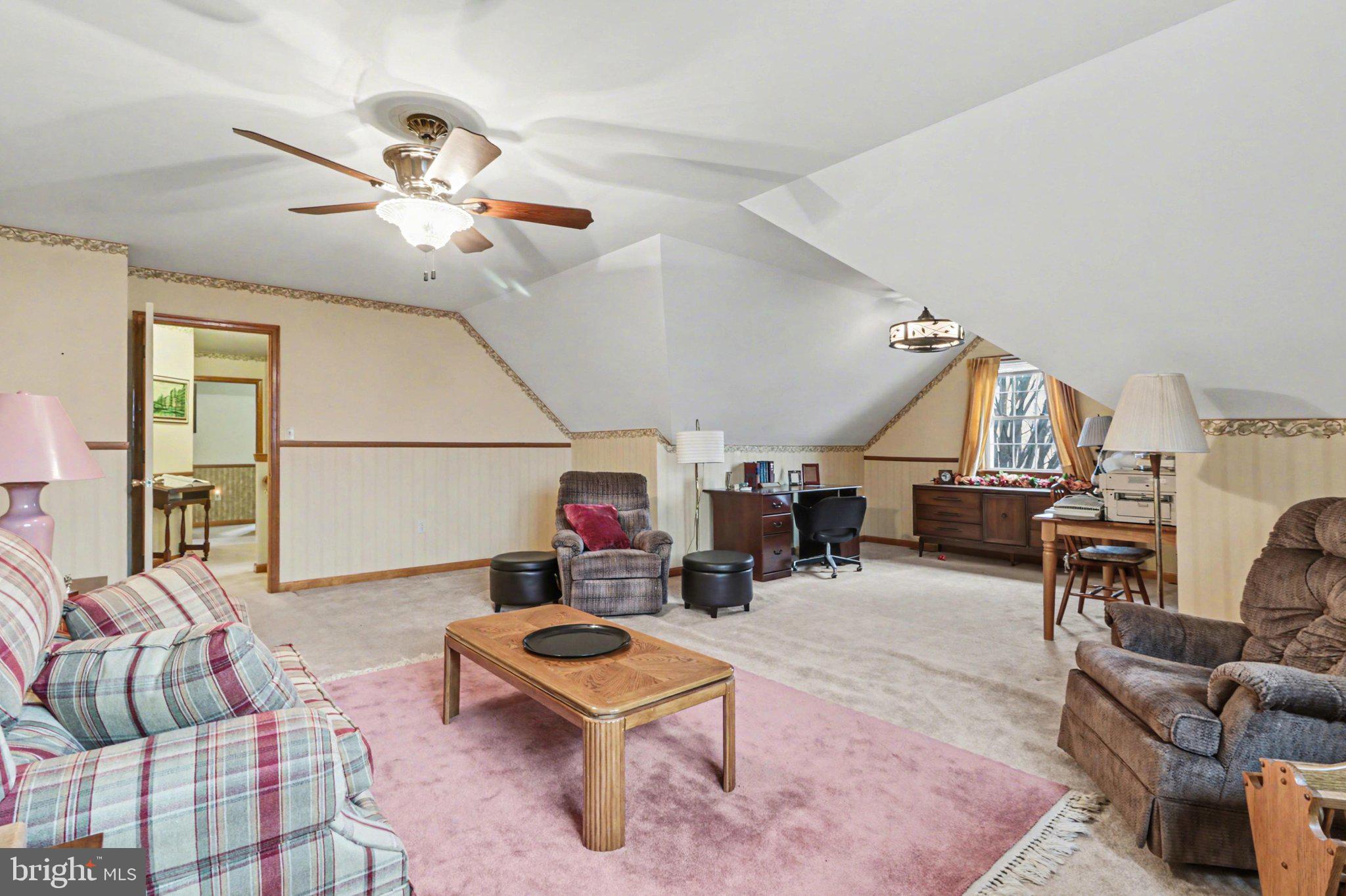 467 Beech Tree Street Shippensburg, PA 17257 - Photo 29 of 54 a living room with furniture a rug and a chandelier