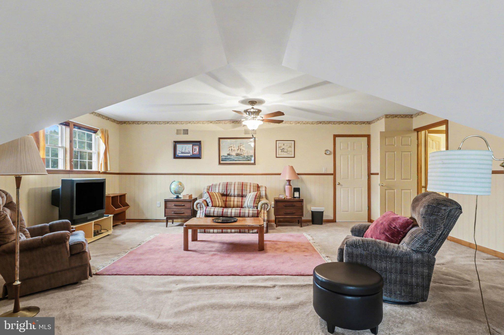 467 Beech Tree Street Shippensburg, PA 17257 - Photo 30 of 54 a living room with furniture a flat screen tv and a window
