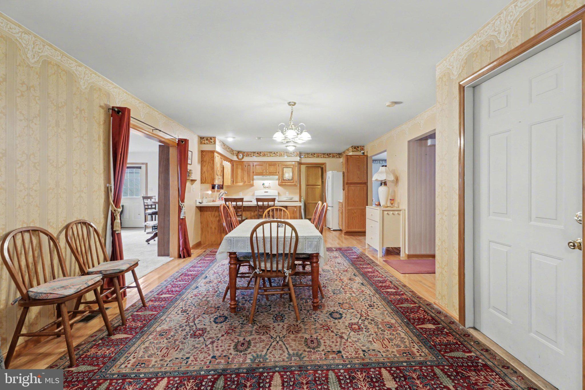 467 Beech Tree Street Shippensburg, PA 17257 - Photo 5 of 54 a dining room with furniture a rug and a chandelier