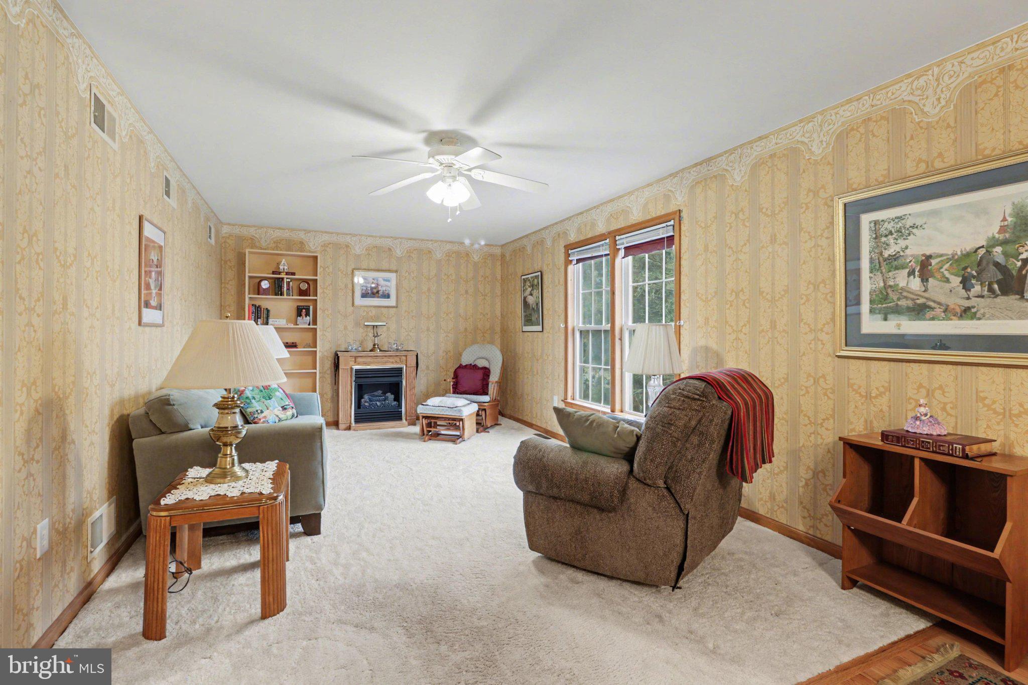 467 Beech Tree Street Shippensburg, PA 17257 - Photo 6 of 54 a living room with furniture a fireplace and a window