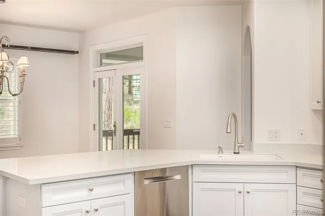 a white toilet sitting next to a bathroom sink
