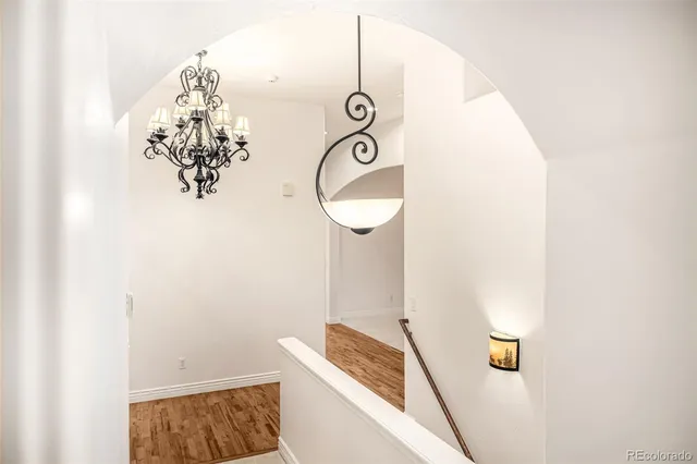 a view of an empty room with a fireplace and a window