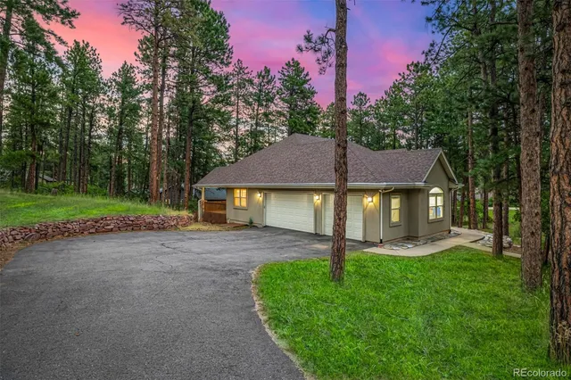 a view of a chairs and a table in the back yard