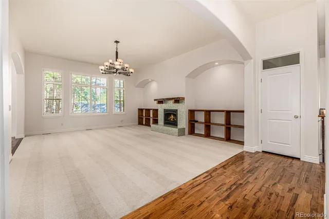 a spacious bedroom with a bed and a large window