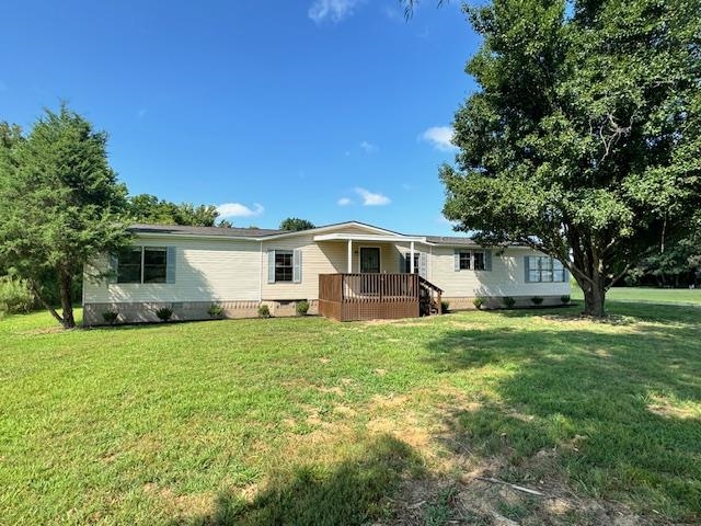 281 Pintail Circle Drummonds, TN 38023 - Photo 1 of 26 a front view of a house with a yard and trees