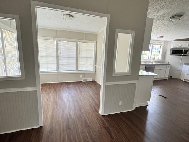 281 Pintail Circle Drummonds, TN 38023 - Photo 13 of 26 an empty room with wooden floor and windows