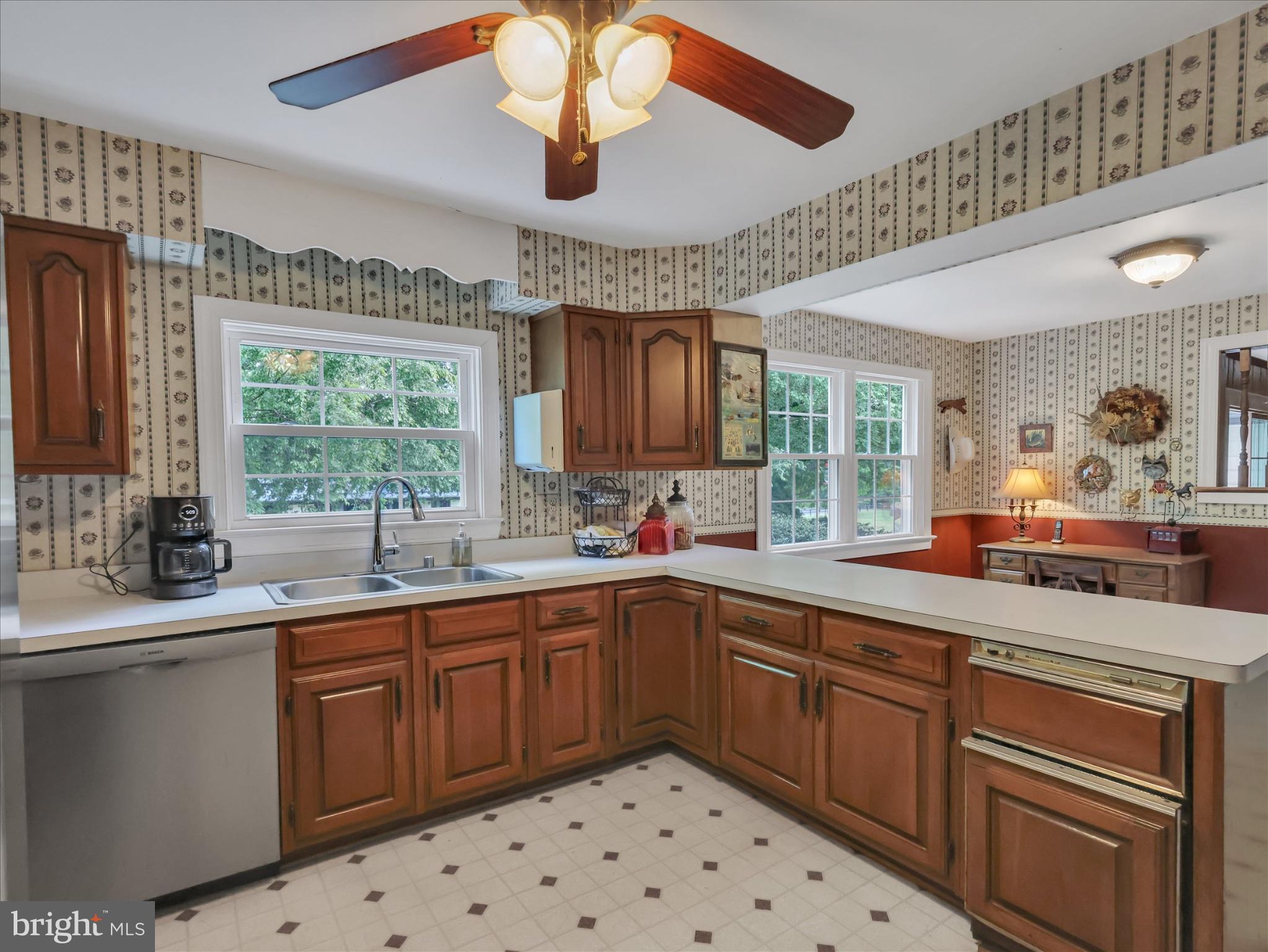 19255 Telegraph Springs Road Purcellville, VA 20132 - Photo 11 of 107 a kitchen with stainless steel appliances a sink stove and cabinets