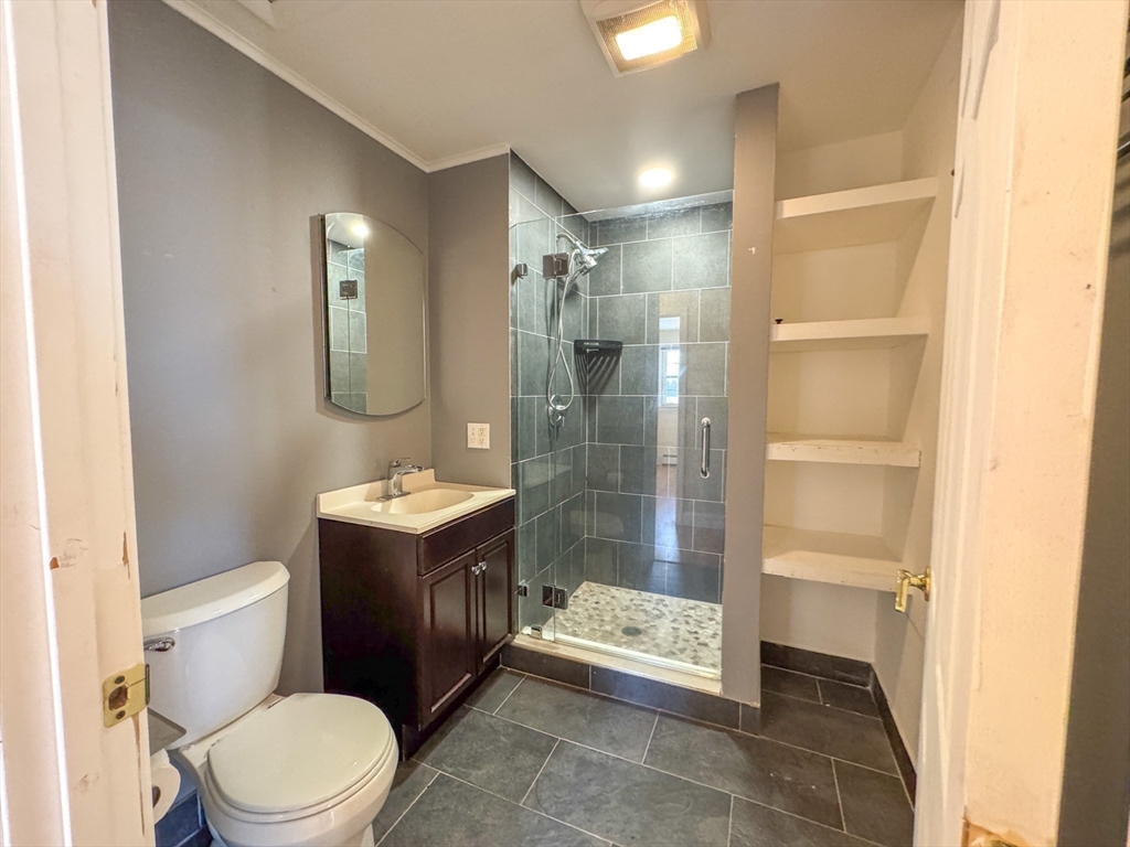 511 Fish Road Tiverton, RI 02878 - Photo 12 of 38 a bathroom with a sink toilet and shower