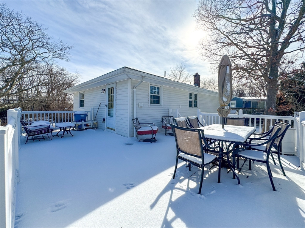 511 Fish Road Tiverton, RI 02878 - Photo 33 of 38 a view of a patio with a table and chairs