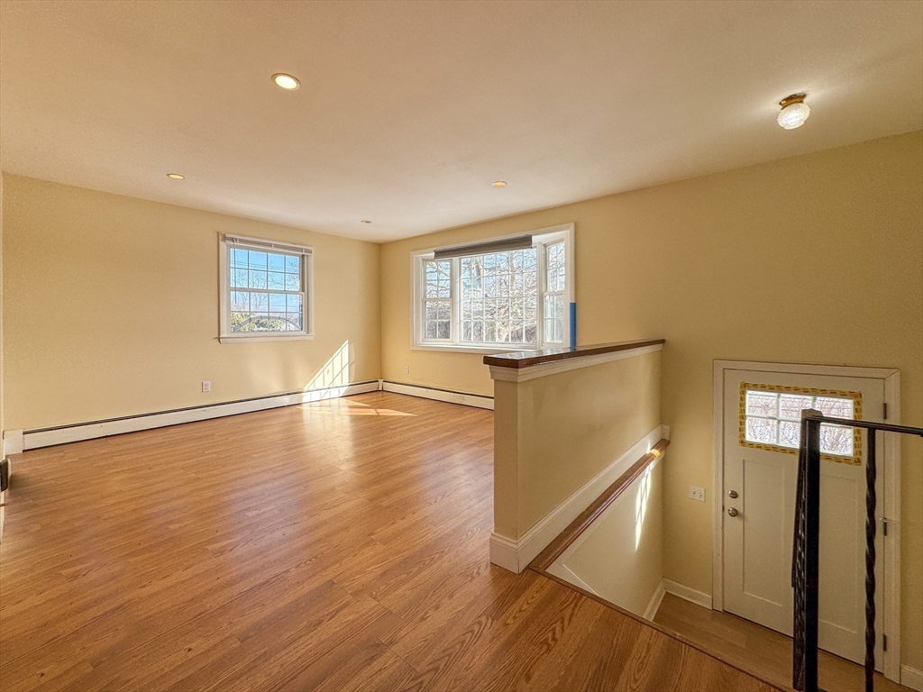 511 Fish Road Tiverton, RI 02878 - Photo 9 of 38 a view of empty room with wooden floor and fan