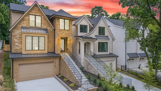 a front view of a house with large windows