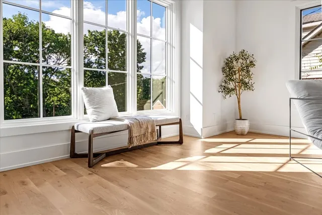 a kitchen with stainless steel appliances a table chairs stove and kitchen island