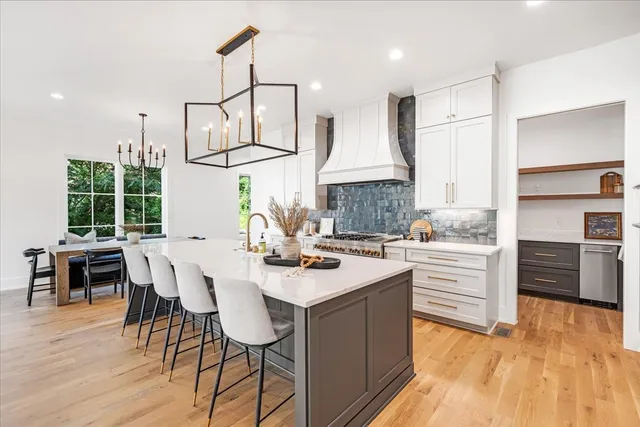 a kitchen with a stove sink and refrigerator