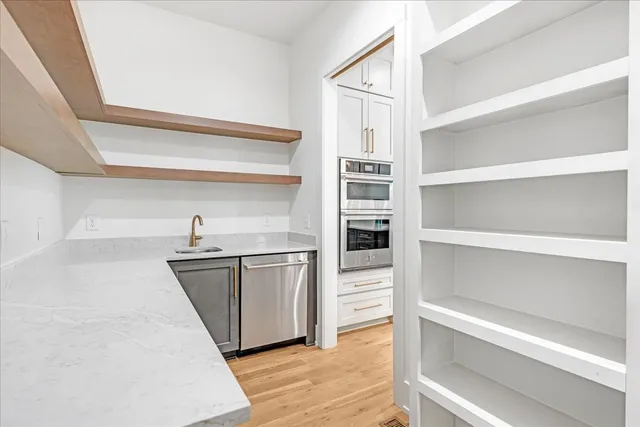 a kitchen with a sink and cabinets
