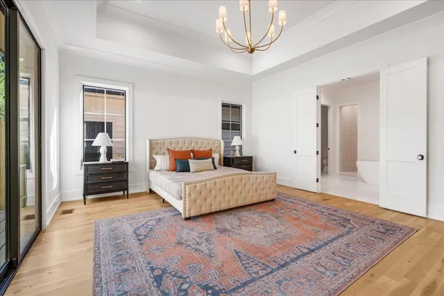 a bedroom with a bed and a mirror