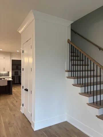 a view of a room with wooden floor
