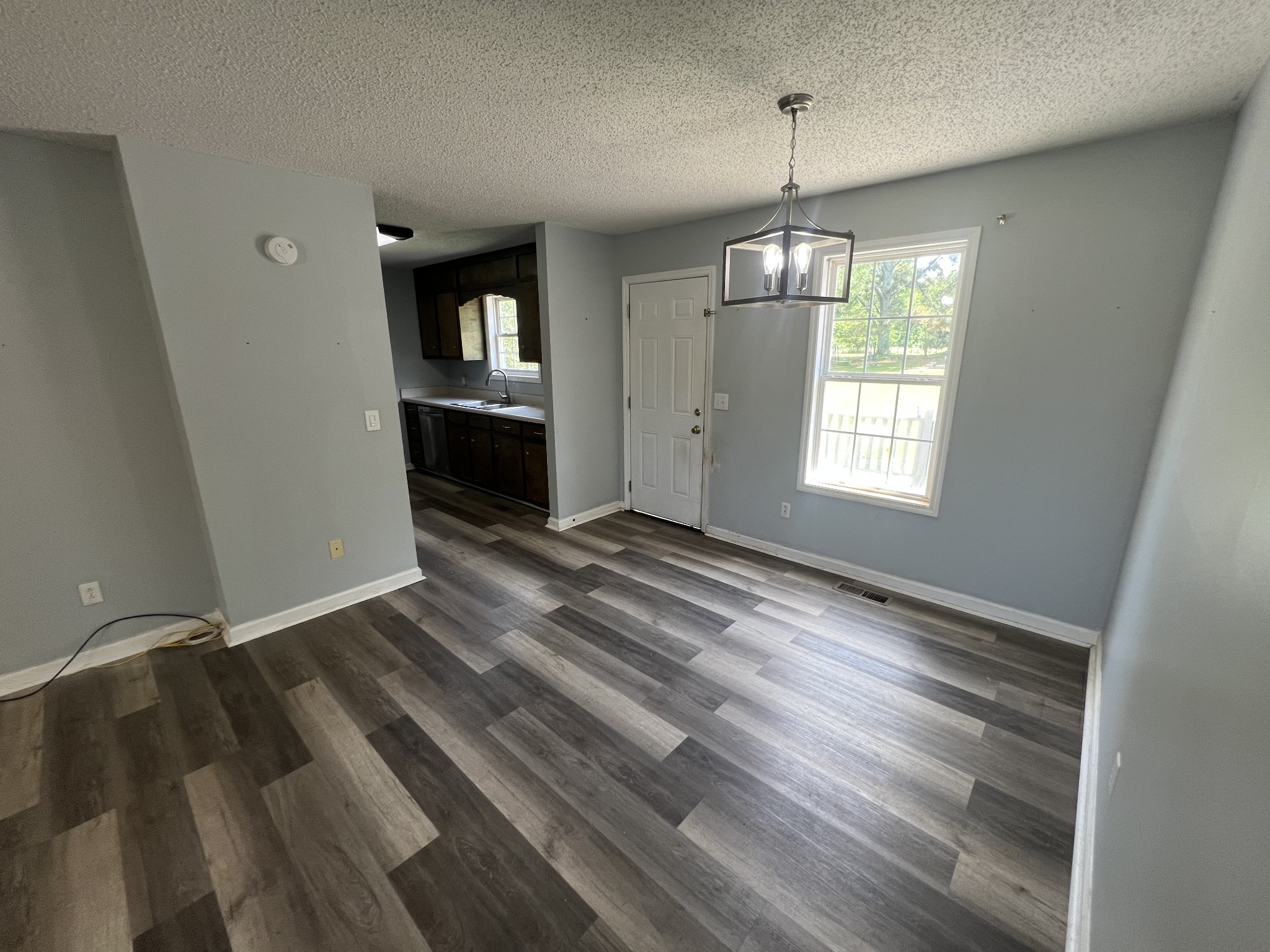 149 Hawthorne Street Pulaski, TN 38478 - Photo 7 of 33 wooden floor in an empty room with a window