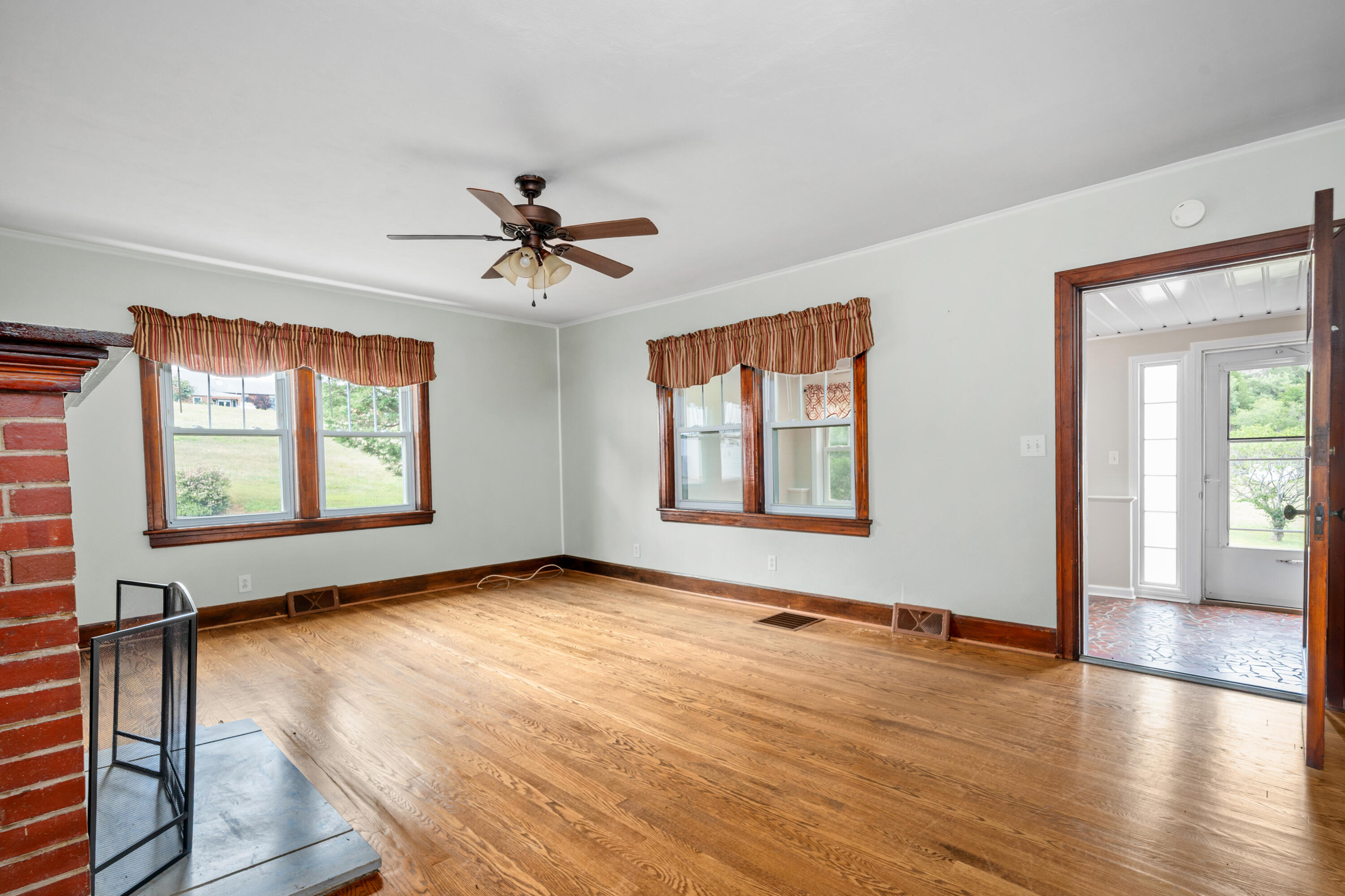 77 Mountain Pass Road Blue Ridge, VA 24064 - Photo 8 of 25 wooden floor in an empty room with a window