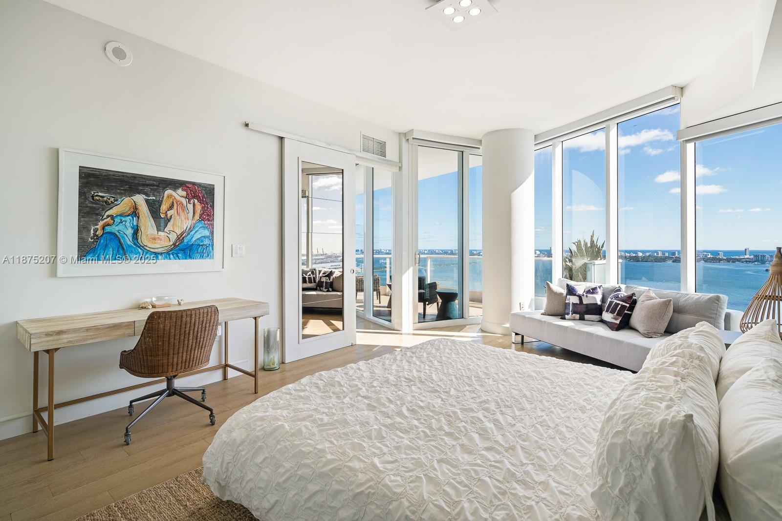 2020 North Bayshore Drive, Unit 4101 Miami, FL 33137 - Photo 14 of 23 a spacious bedroom with a large bed and a large window