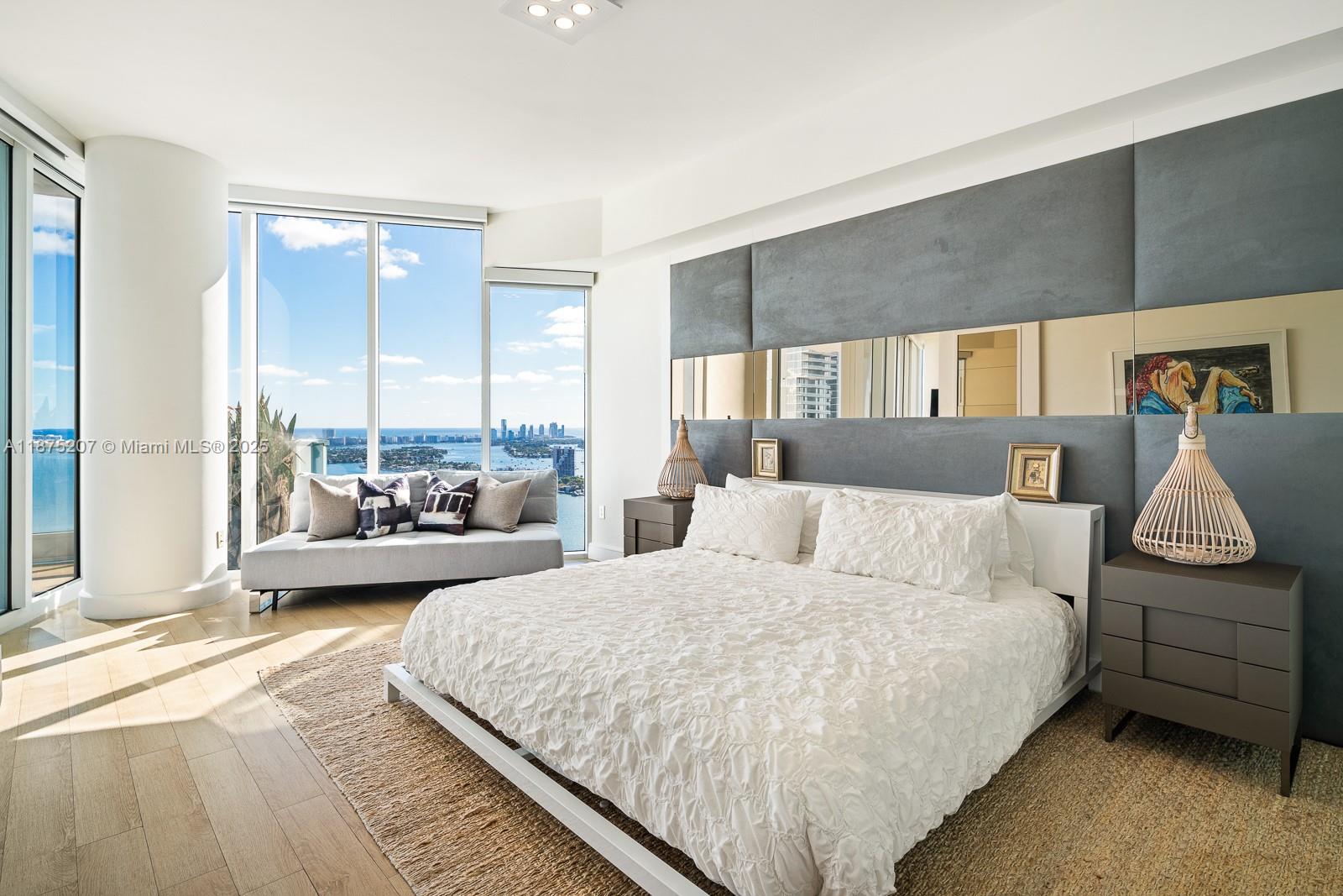 2020 North Bayshore Drive, Unit 4101 Miami, FL 33137 - Photo 15 of 23 a bedroom with a large bed and a couch