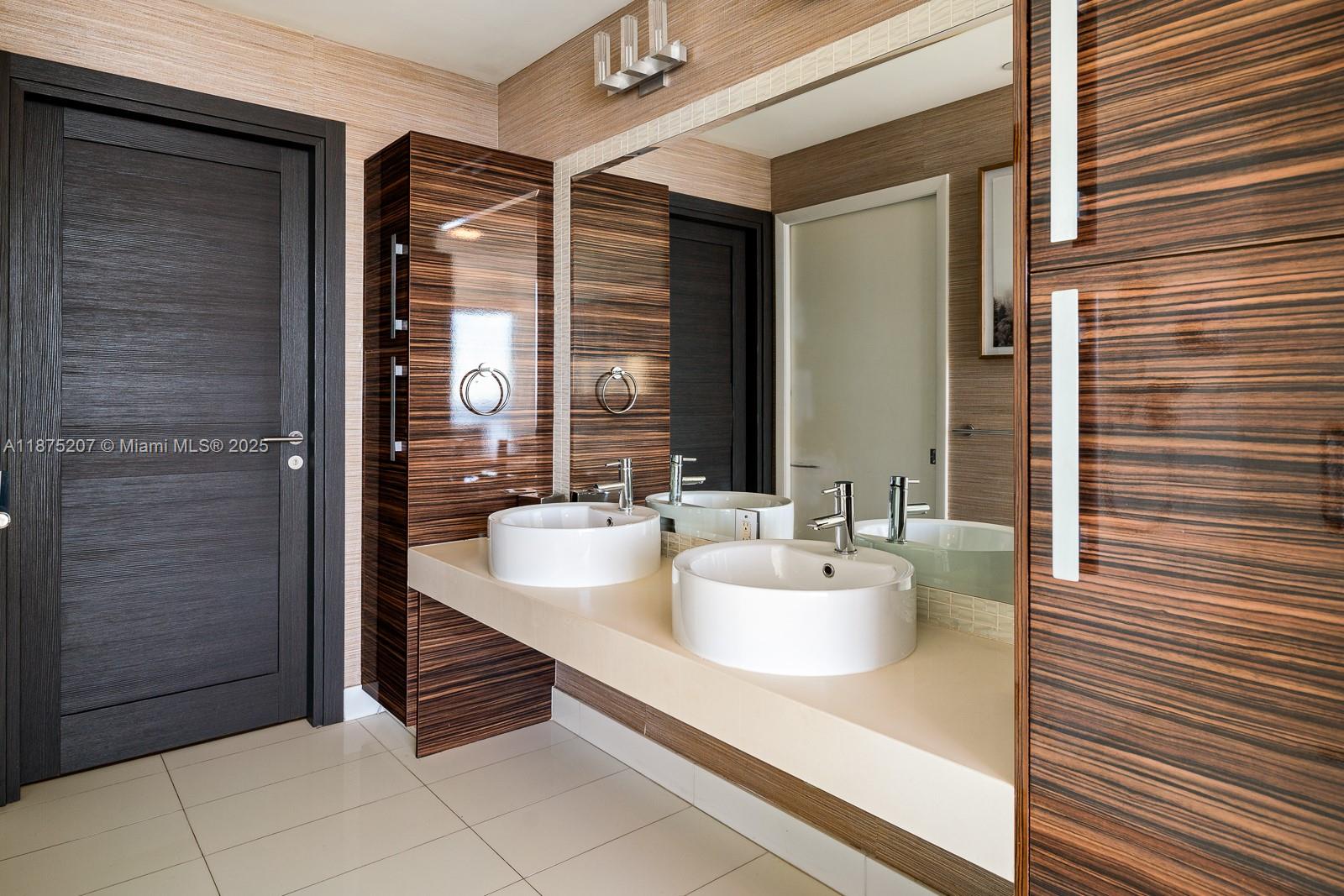 2020 North Bayshore Drive, Unit 4101 Miami, FL 33137 - Photo 18 of 23 a bathroom with a sink and a mirror