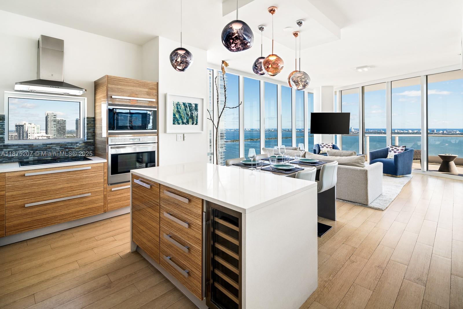 2020 North Bayshore Drive, Unit 4101 Miami, FL 33137 - Photo 3 of 23 a kitchen that has a lot of cabinets in it