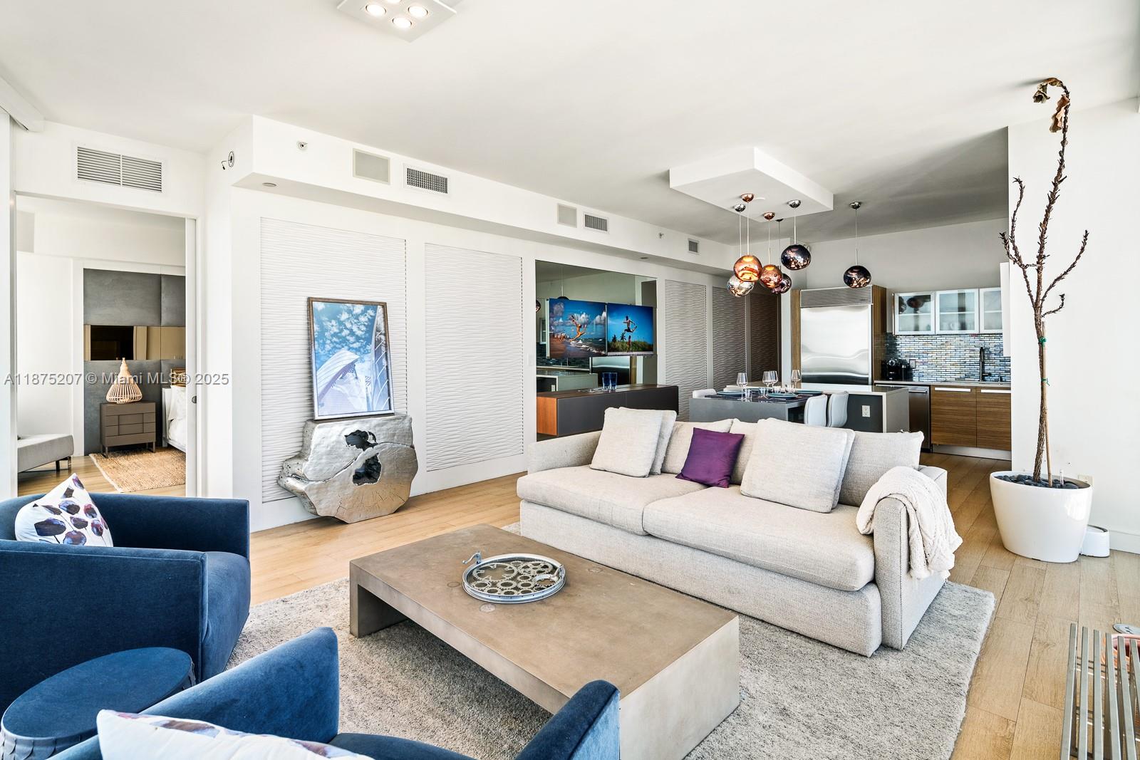 2020 North Bayshore Drive, Unit 4101 Miami, FL 33137 - Photo 4 of 23 a living room with furniture and a rug