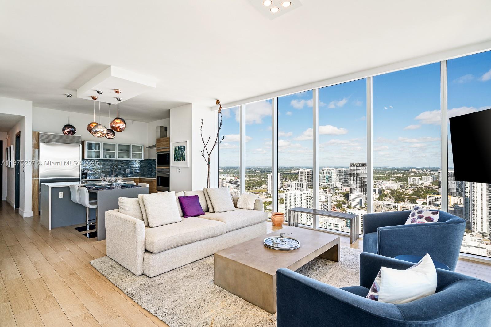 2020 North Bayshore Drive, Unit 4101 Miami, FL 33137 - Photo 5 of 23 a living room with furniture and a flat screen tv