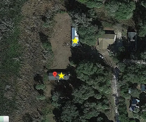 a backyard of a house with lots of green space