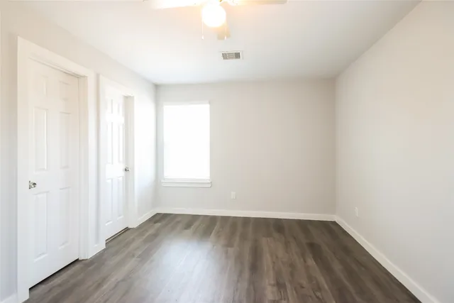 a view of a room that has wooden floor in it