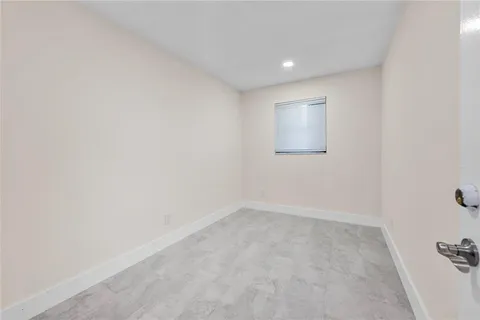 a spacious bathroom with a sink a toilet and shower