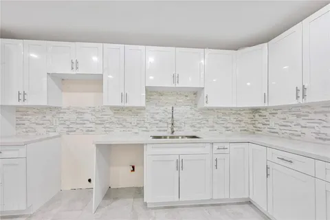 a large kitchen with cabinets