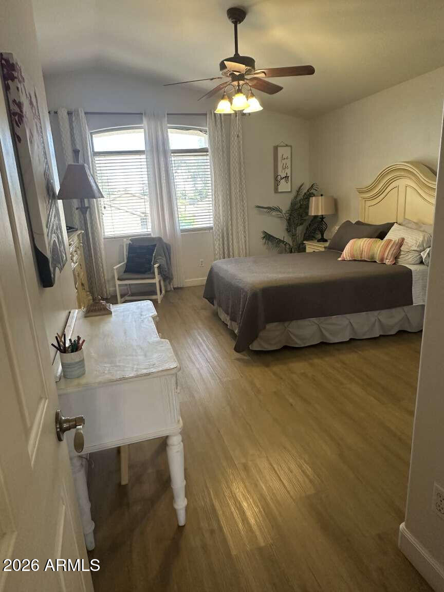 2576 East Brooks Street Gilbert, AZ 85296 - Photo 11 of 18 a bedroom with a bed window and a table