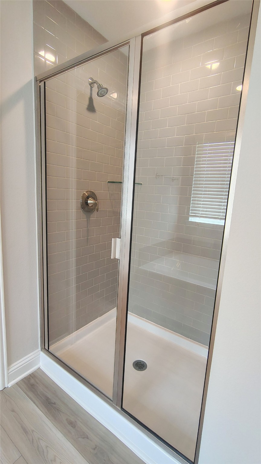 5 Keystone Court Angleton, TX 77515 - Photo 13 of 18 a bathroom with a glass door shower