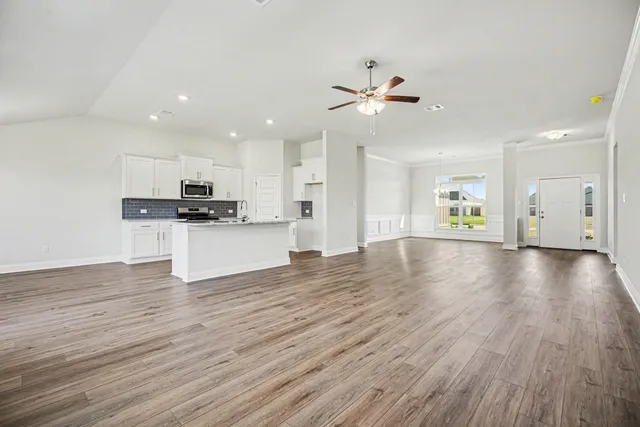 a view of a kitchen with a sink and a stove top oven