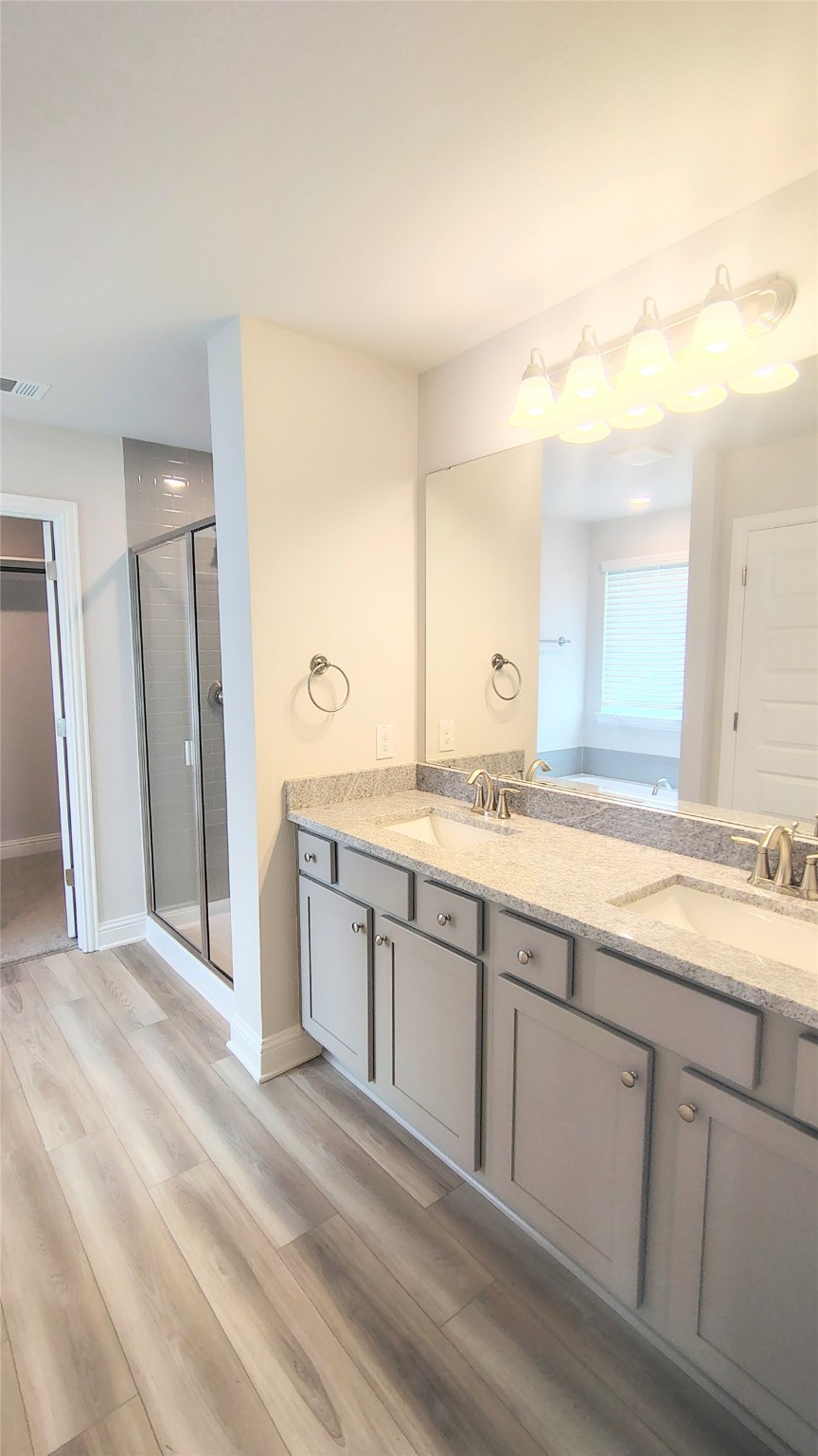 5 Keystone Court Angleton, TX 77515 - Photo 10 of 18 a spacious bathroom with a granite countertop sink mirror and a