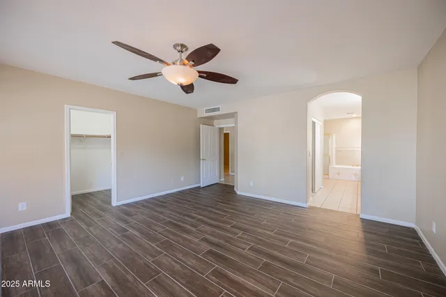a large bathroom with a double vanity sink a large mirror and a shower