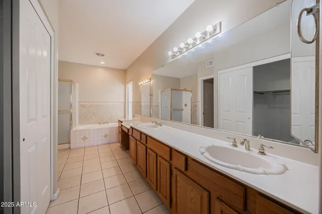a bathroom with a bathtub and a sink