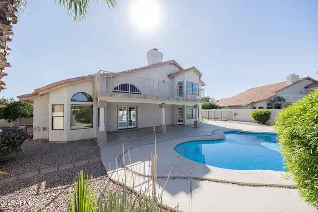 a view of a house with a swimming pool