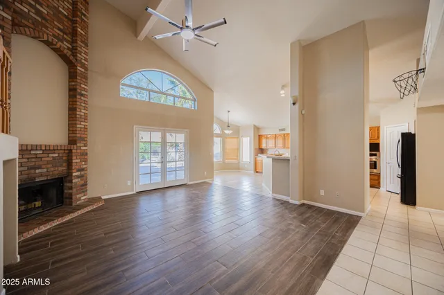 a view of a large kitchen with wooden floor and a sink